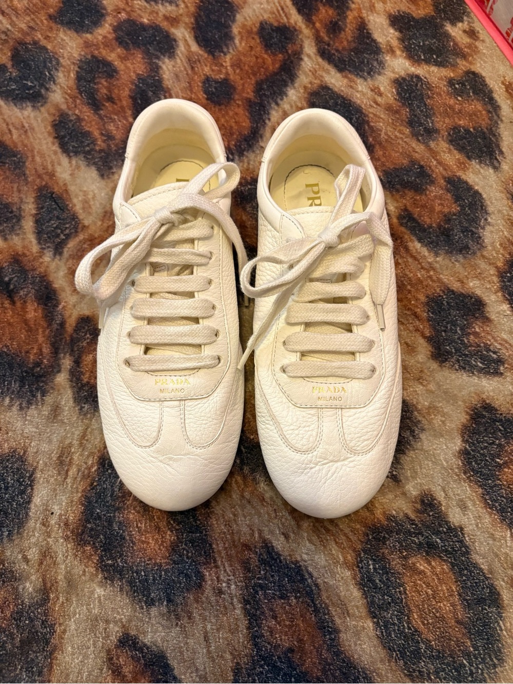 Women's PRADA thin leather low top sneaker. Worn once. Authentic